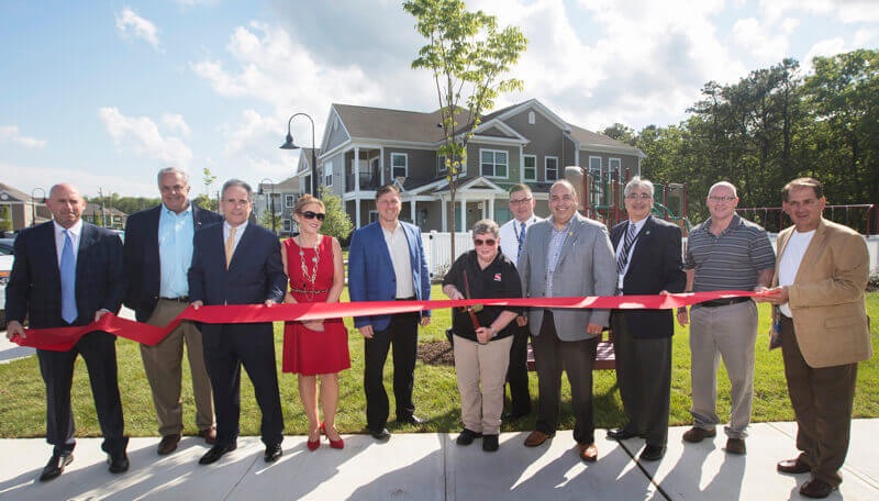 Walters Group Apartments Staff Cutting Ribbon for Cornerstone at Lacey Opening