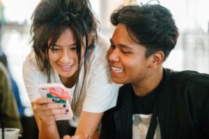 Young adults looking at a phone